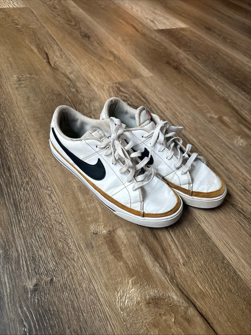 Nike White Sneakers with Black Swoosh and Brown Trim